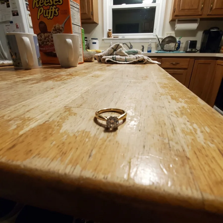 A phone photo of a gold diamond ring turned into a studio packshot — original photo